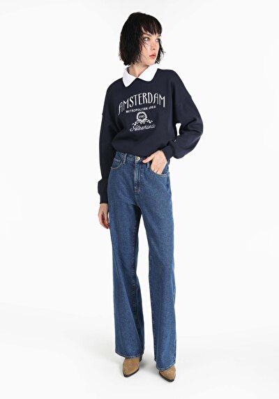 صورة من   خصر عالي ساق واسعة نسائي نيلي جينز