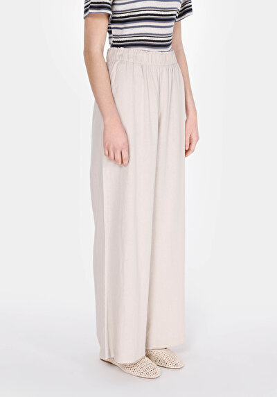 صورة من عادي مناسب بخصر عالي ساق واسعة بنطلون بيج نسائي